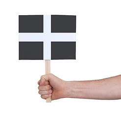 Image showing Hand holding small card - Flag of Cornwall