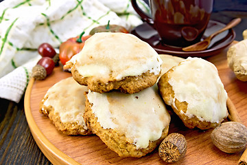 Image showing Cookies pumpkin with cup and spices on tray