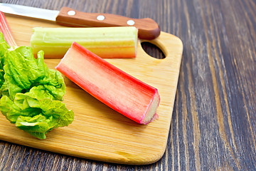 Image showing Rhubarb with knife on board