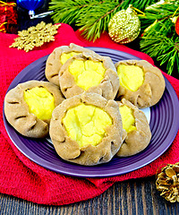 Image showing Carols with potatoes on red napkin with Christmas toys