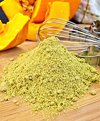 Image showing Flour pumpkin with mixer and sieve on board