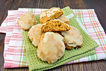 Image showing Cookies pumpkin on kitchen towel and board
