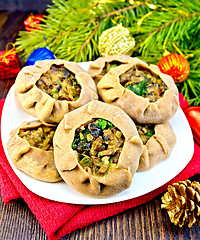 Image showing Carols with mushrooms on red napkin with Christmas toys