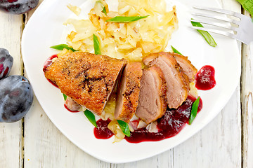 Image showing Duck breast with cabbage and green onions in plate