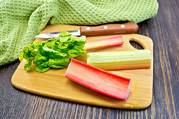 Image showing Rhubarb with knife and napkin on board