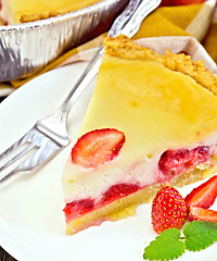 Image showing Pie strawberry with sour cream and mint on board