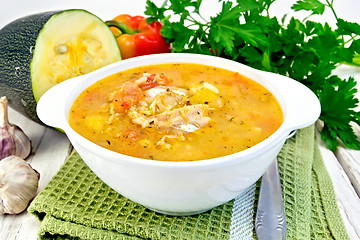 Image showing Soup fish with zucchini and peppers on board