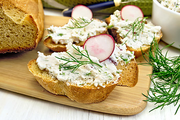 Image showing Bread with pate of curd and radish on board