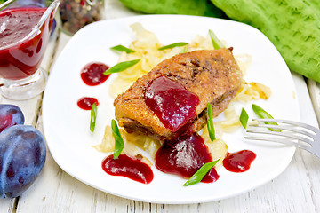 Image showing Duck breast whole with plum sauce and cabbage in plate