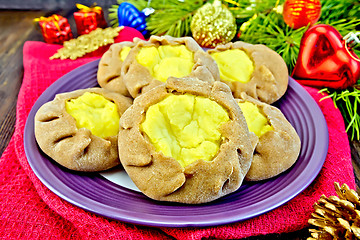 Image showing Carols with potatoes on napkin with Christmas toys