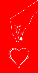 Image showing Heart in hand on red