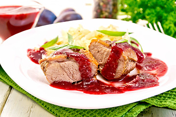 Image showing Duck breast with plum sauce and cabbage in plate