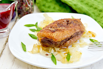 Image showing Duck breast whole with cabbage and green onions in plate