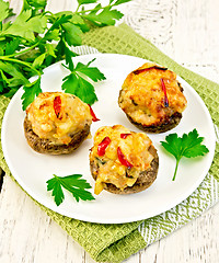 Image showing Champignons stuffed meat in white plate on napkin