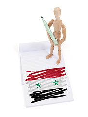 Image showing Wooden mannequin made a drawing - Syria