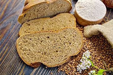 Image showing Bread buckwheat with groats and flower on board