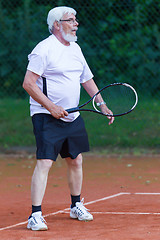 Image showing Senior man playing tennis