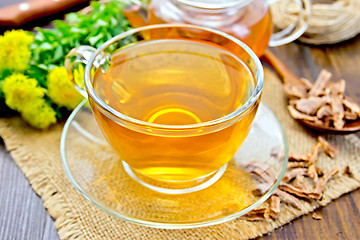 Image showing Tea of Rhodiola rosea in glass cup on sacking