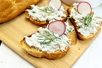 Image showing Bread with pate of curd and radish on light board