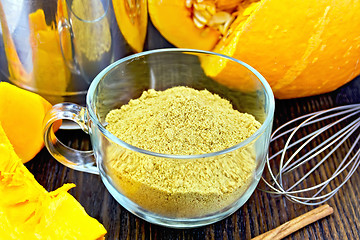 Image showing Flour pumpkin in glass cup with mixer on board