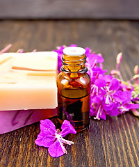 Image showing Oil and soap with fireweed on board