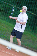 Image showing Senior man playing tennis