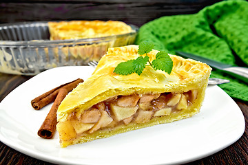 Image showing Pie apple with mint in plate on dark board