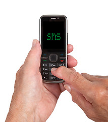 Image showing Hands of senior woman with a mobile phone