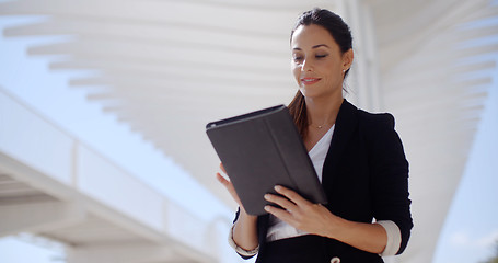 Image showing Elegant businesswoman on a seafront promenade