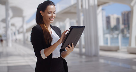 Image showing Smiling woman surfing the internet