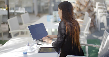 Image showing Businesswoman typing on her laptop computer