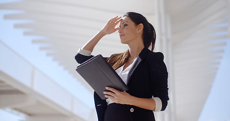 Image showing Elegant businesswoman on a seafront promenade