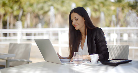 Image showing Pretty stylish woman using her laptop