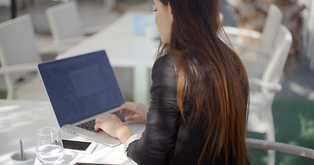 Image showing Businesswoman typing on her laptop computer