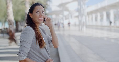 Image showing Relaxed young woman talking on her mobile