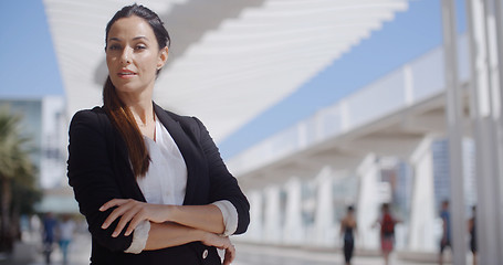 Image showing Thoughtful businesswoman with folded arms