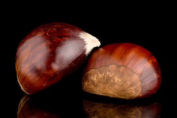 Image showing Chestnuts on a black reflective background