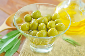 Image showing green olives and oil