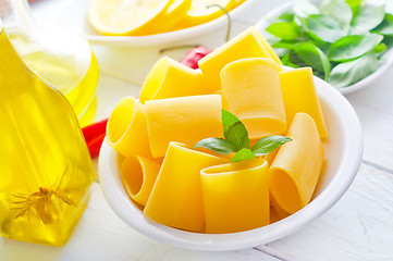 Image showing raw pasta with aroma spice and oil in the bottle