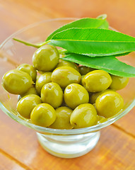 Image showing green olives and oil