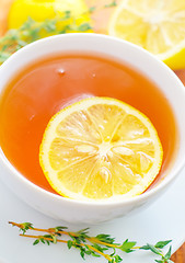 Image showing Fresh tea with lemon in the white cup