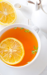 Image showing Fresh tea with lemon in the white cup