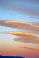 Image showing sunrise in the colored sky white   clouds and  background