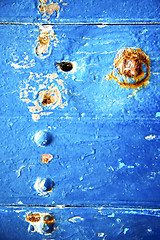 Image showing stripped paint in   blue  r and rusty  