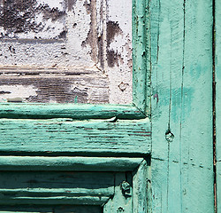 Image showing spain canarias brass brown knocker in a green 