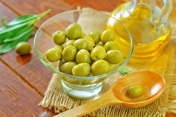 Image showing green olives and oil