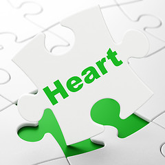Image showing Medicine concept: Heart on puzzle background