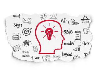 Image showing Advertising concept: Head With Lightbulb on Torn Paper background