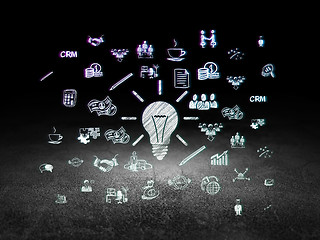 Image showing Business concept: Light Bulb in grunge dark room