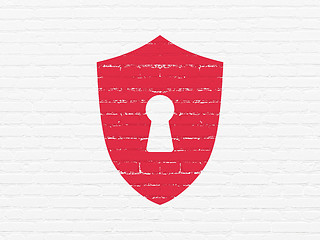 Image showing Security concept: Shield With Keyhole on wall background